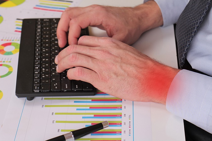 Businessman analyzing data. Close up of man hands typing on computer keyboard